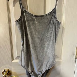 worn a few times velour material size small brand heart and hips body suit